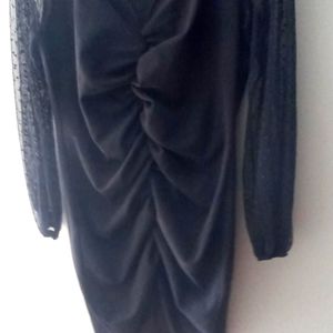 Black above knee sheer long sleeved ruched dress